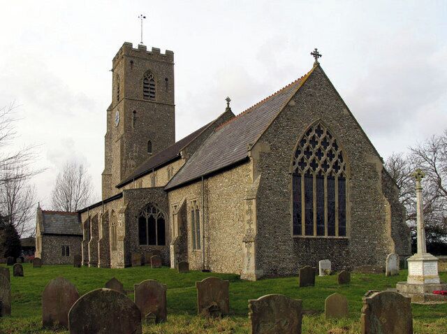 A historic church with a tall tower and arched windows.