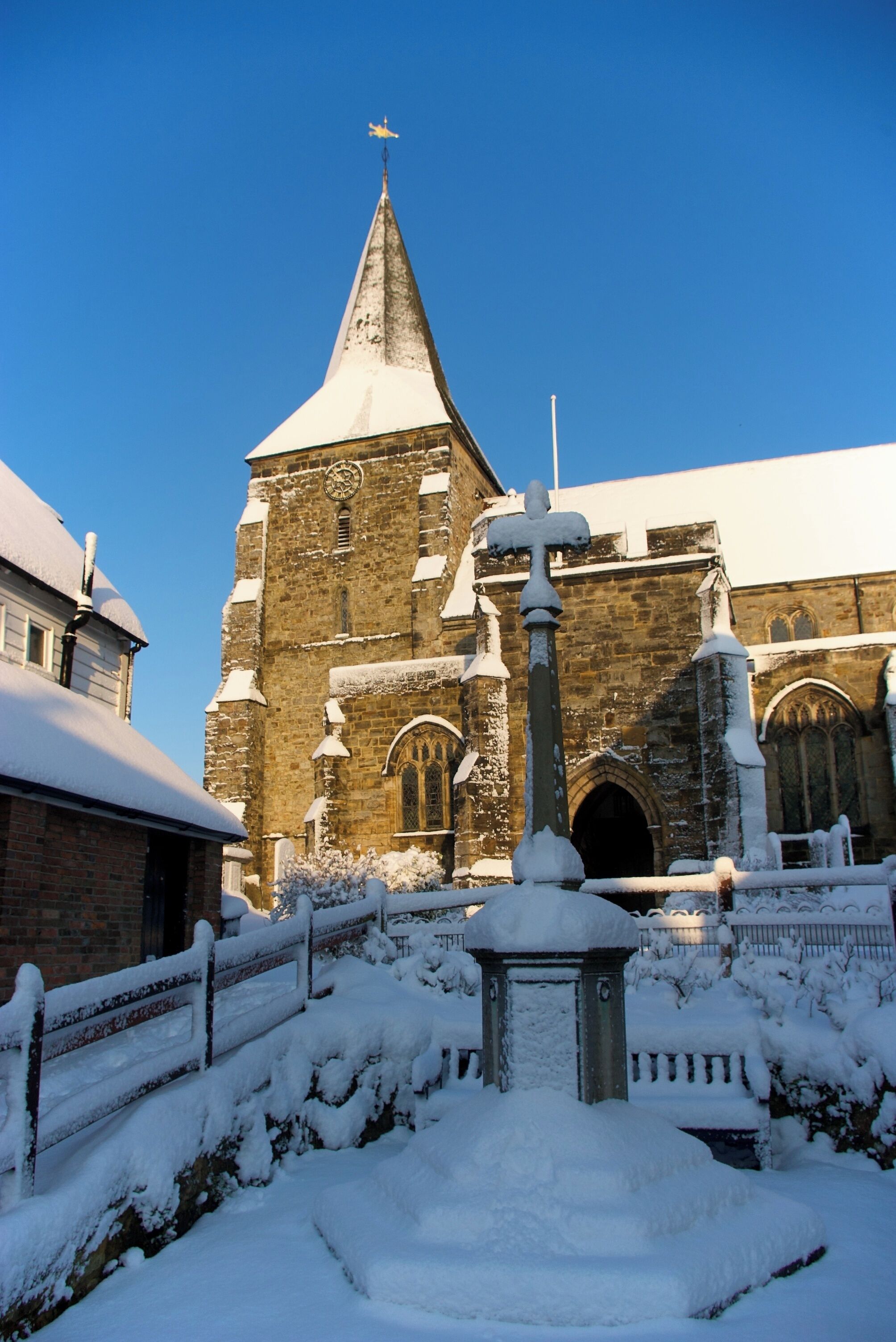 St Dunstan's Church in Mayfield and the war memorial outside, covered in snow on 2009-12-18.