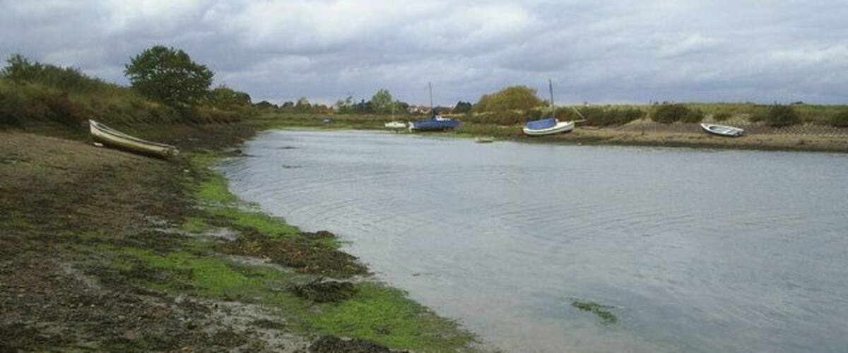Goldhanger creek View of the upper reach of Goldhanger creek facing north west,with the tide coming in, some rooftops in the village can be seen in the distance.