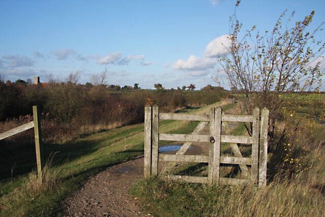 Gated footpath at Goldhanger The footpath follows the river wall around the inlet at Goldhanger Creek.