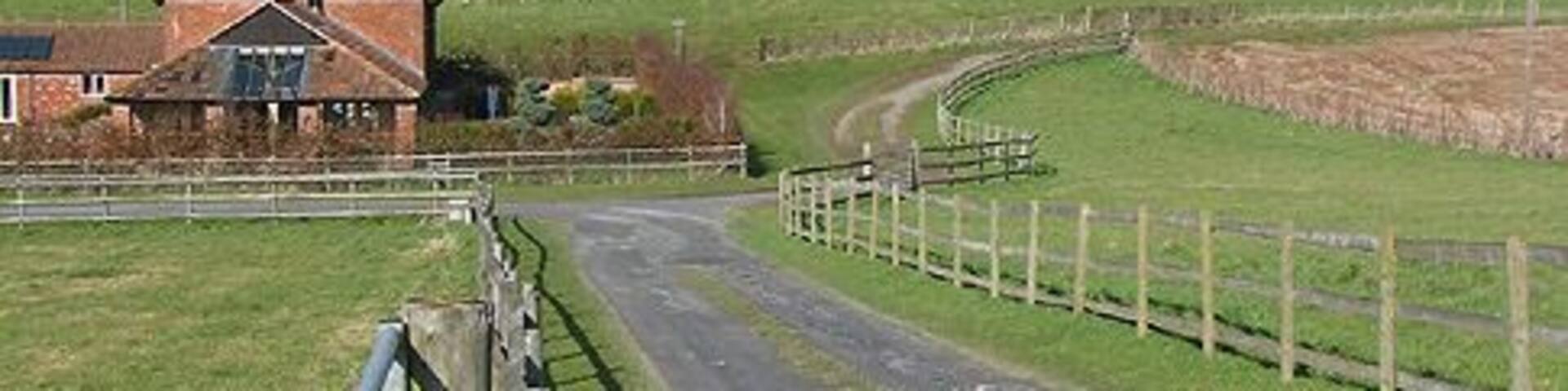 View from a footpath near Lugwardine Chapel Gently rolling hillsides, criss-crossed by several footpaths.