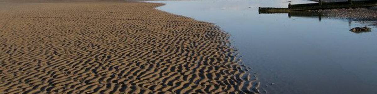 Romney Sands The ripples in the sand have been caught by the late evening sun.