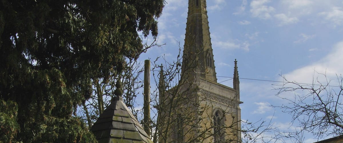 Waltham on the Wolds Well Church and Telephone Box at village centre. The well is filled in.
