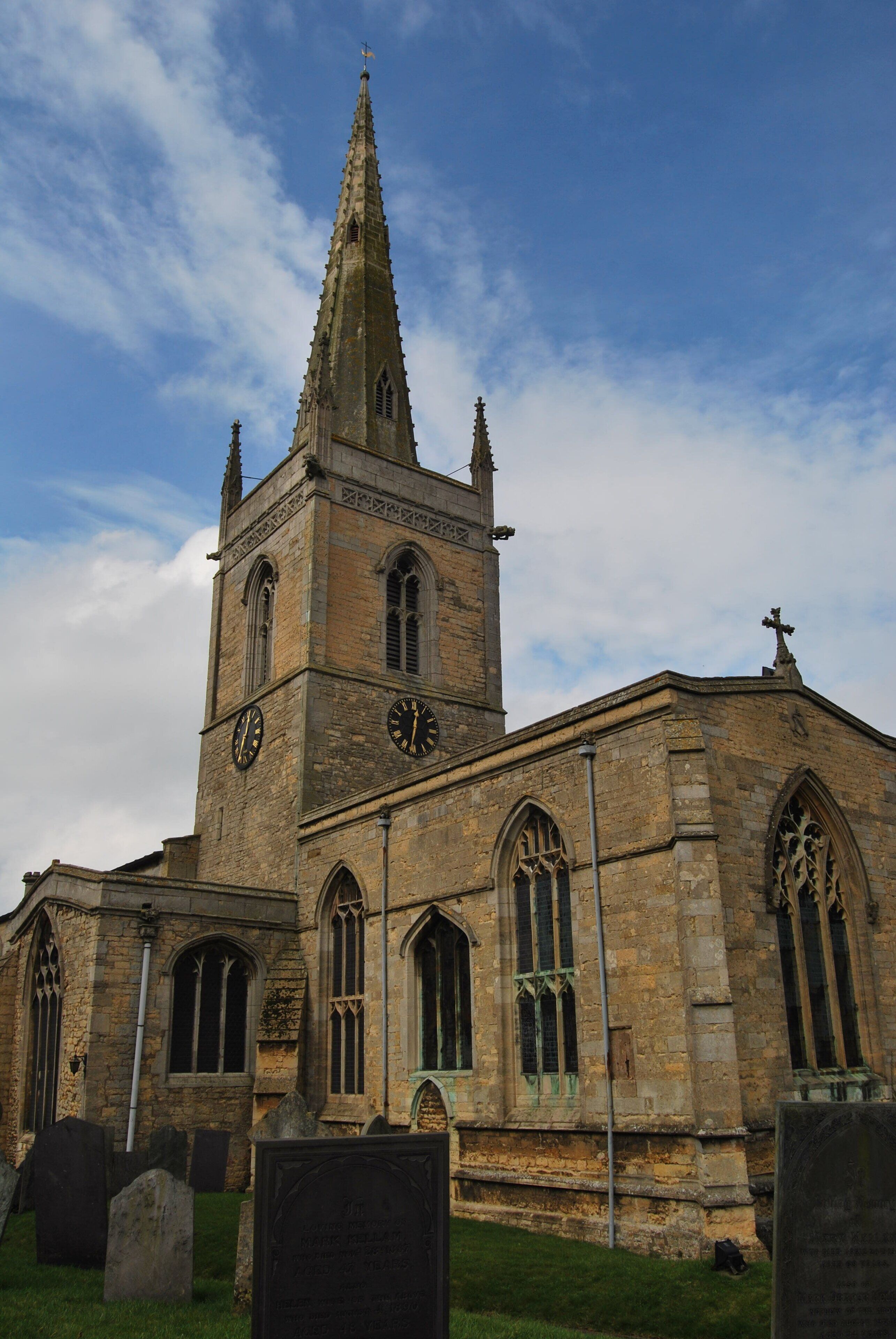 A historic church with a tall spire and clock tower.