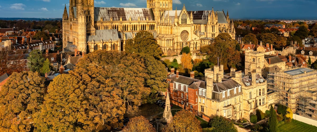 A historic cathedral with twin towers and a large rose window.