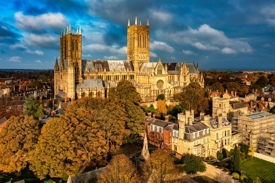 A historic cathedral with twin towers and a large rose window.