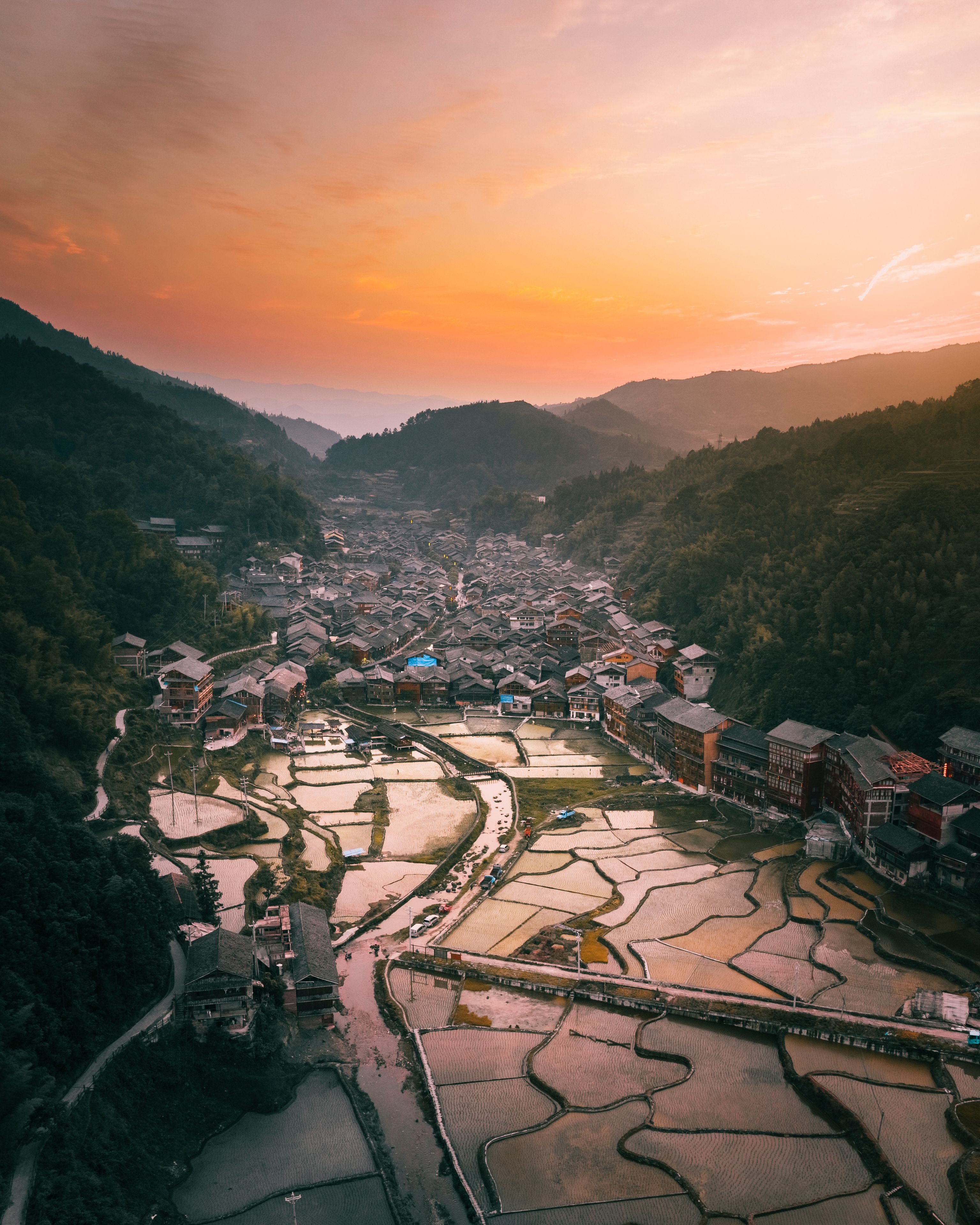 Aerial view of Miao village with rice terraces at sunset in Yunnan Province, Liping County, Qiandongnan Miao and Dong Autonomous Prefecture, Guizhou, China.