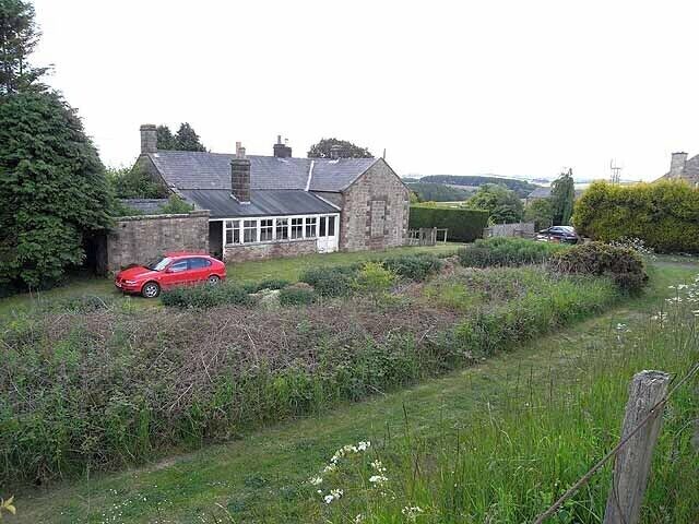 Former Knowesgate Station The Wansbeck Valley Railway ("The Wannie") which meandered across the interior of Northumberland linking Morpeth with Redesmouth on the old Border Counties Railway. The line operated between 1865 and 1966. The car is parked on what was the platform in front of the old station building.