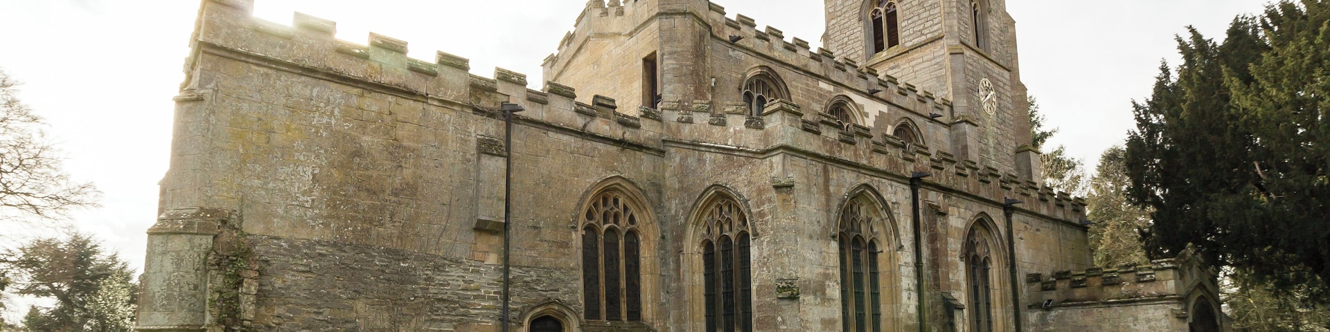 Pic by Jenny. The church dates from the 14th century onwards and is located in the grounds of Kelham Hall. It consists of a west tower, nave with north and south aisles and clerestory, north and south porches, chancel, and a south chancel Chapel (Lexington Chapel). The tower is of four stages and has crocketted pinnacles. It dates from the 15th century, although the base is older. All of the exterior is embattled. The nave is of three bays, mostly with 15th century windows. Both arcades date from the late 14th century. The roof is 19th century. The chancel screen is late perpendicular with elaborate tracery. There is also a parclose screen to the Lexington Chapel. The north porch is 15th century, with an original door. The south porch is similar but with a 19th-century door. This is currently not used. The chancel has a five-light late 15th century east window, with 19th C. stained-glass. To the south of the chancel is the Lexington Chapel which was built in 1723 and contains a freestanding monument to Robert Sutton Lord Lexington, d. 1723 and lady Lexington, d. 1703. The sculptures are by William Palmer. The font is probably the oldest piece in the church, dating from the 13th century with a later base, and a 19th century wooden conical cover. Most of the fittings are from the 19th century, but the octagonal timber pulpit has a 17th century moulded stem and base, although the upper part is much later. The church was restored in 1874 by Hodgson Fowler.