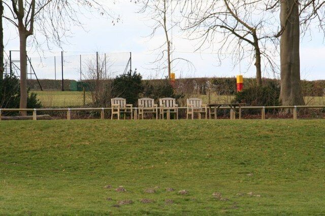 Empty seats by the school Every one is away for half term so the seats remain empty looking towards the river.
