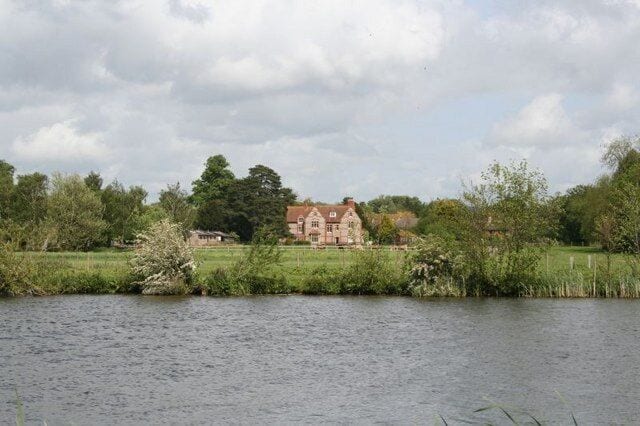 The Old Vicarage, South Stoke, Oxfordshire, seen across the River Thames from near Moulsford
