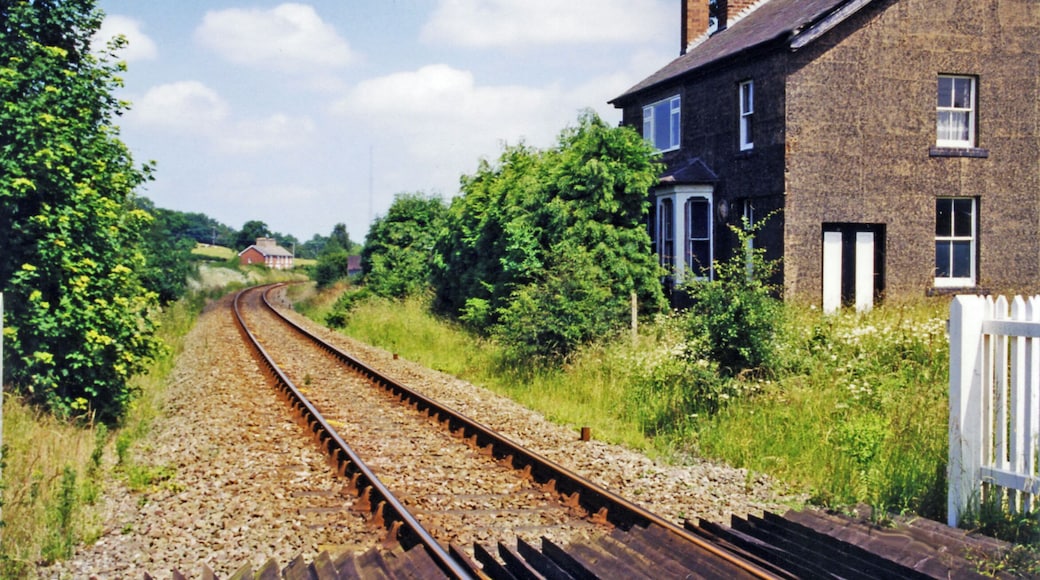 Hanwood station (site/remains). View NE, towards Shrewsbury: ex-GW&LNW Joint Shrewsbury - Buttingon (- Welshpool) secondary main line, junction of branch to Minsterley. The station was closed to passengers 12/9/60 (goods 4/5/64), but the line remains open for trains to Aberystwyth etc. via Buttington and Welshpool. The Minsterley branch, which joined about a half mile to the west, was closed to passengers 5/2/51, to goods 1/5/67.