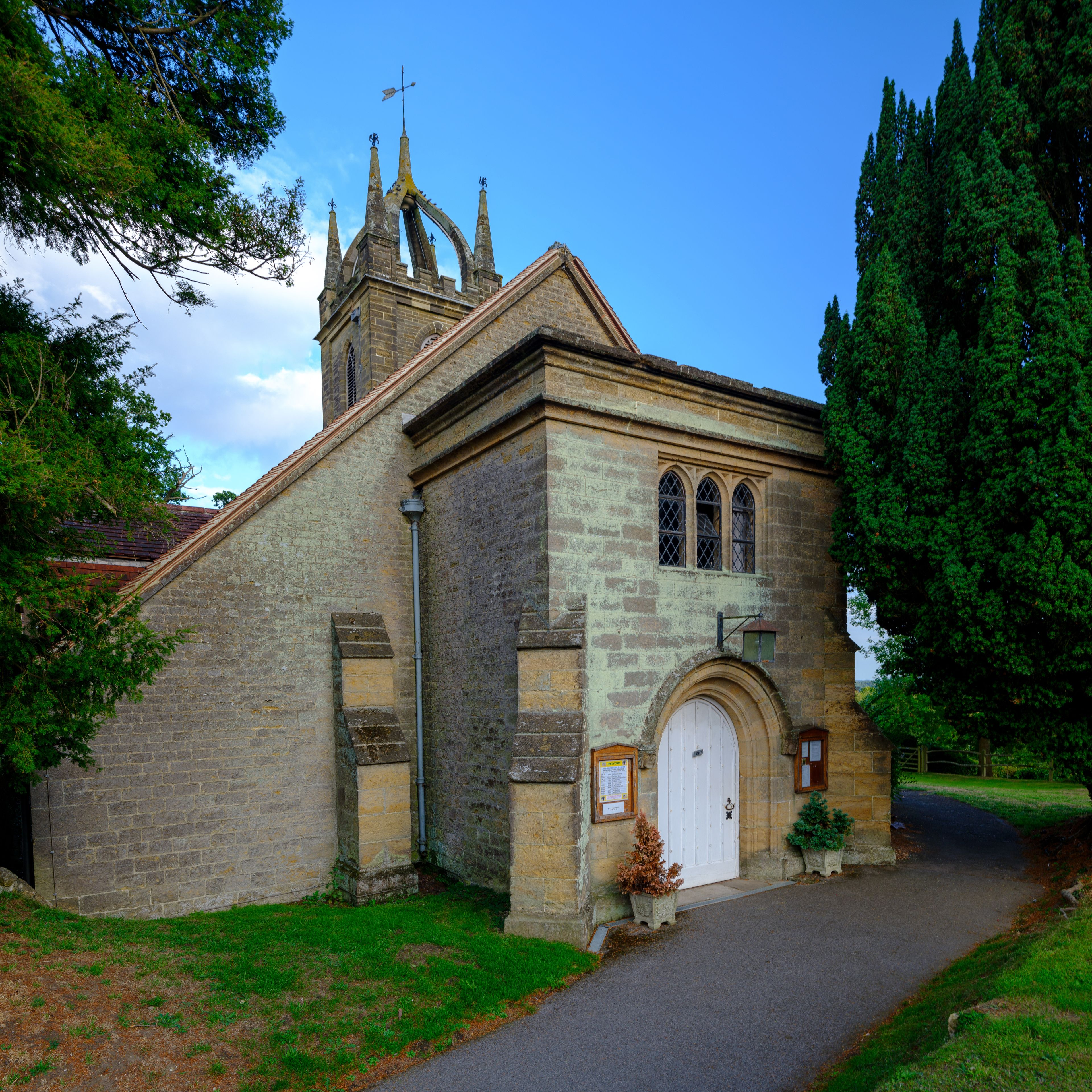 Late afternoon summer light on All Hallow's Church at Tillington next to the Petworth Estate in the South Downs National Park, West Sussex, UK