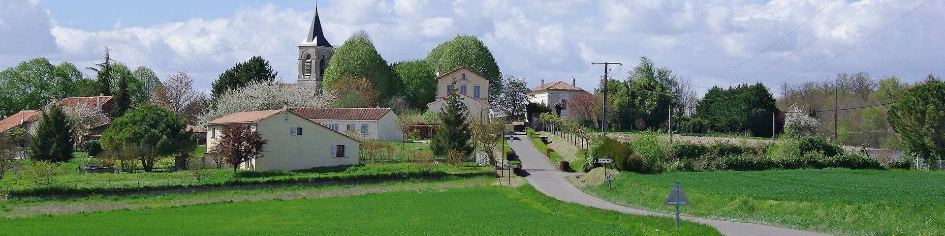 S.-E. view of the village, from road D 439. Chavenat, Charente, France.