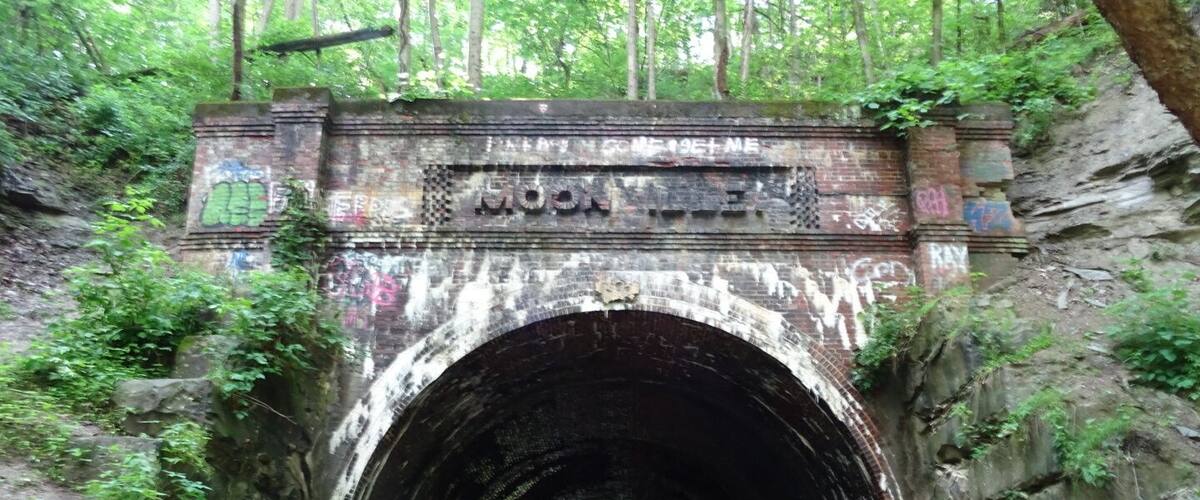 About all that remains of Moonville is this old railroad tunnel. The town sprang up in the late 1800's because of the Marietta and Cincinnati railroad building through the uninhabited forest on its way to Cincinnati.
The coal town's population peaked at just over one hundred. The last family left town in 1947. By the 1960s most of the buildings were gone and only the tunnel survives today.
The Moonville Tunnel can be accessed via The Moonville Rail-Trail, a sixteen-mile #hiking trail comprising the abandoned railway inside the Zaleski State Forest.