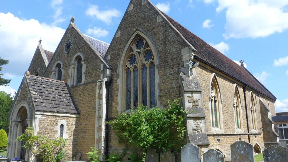 A historic church with pointed arches and stained glass windows.