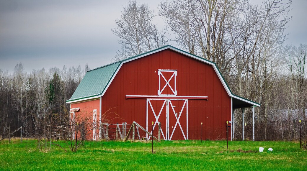 A red barn in a field in Orwell, Ohio