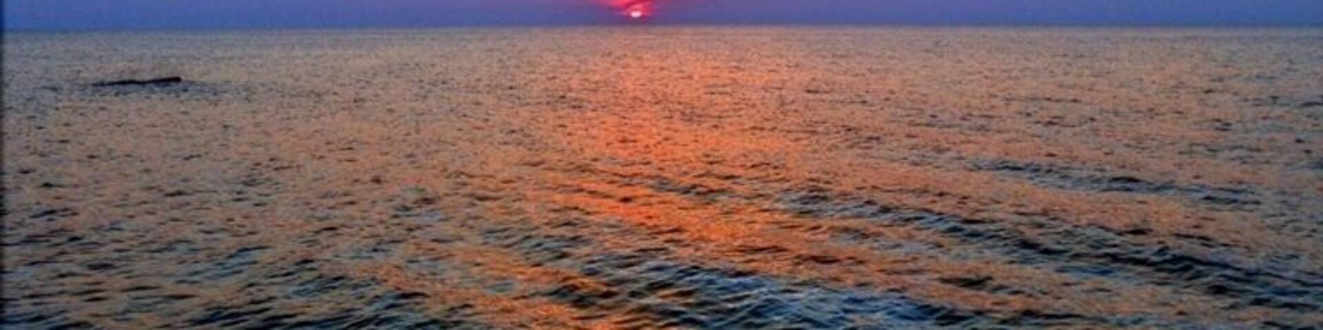 Go to the park behind the police and fire station at sunset for a nice view.
Look for the little path that will lead you down to the beach.