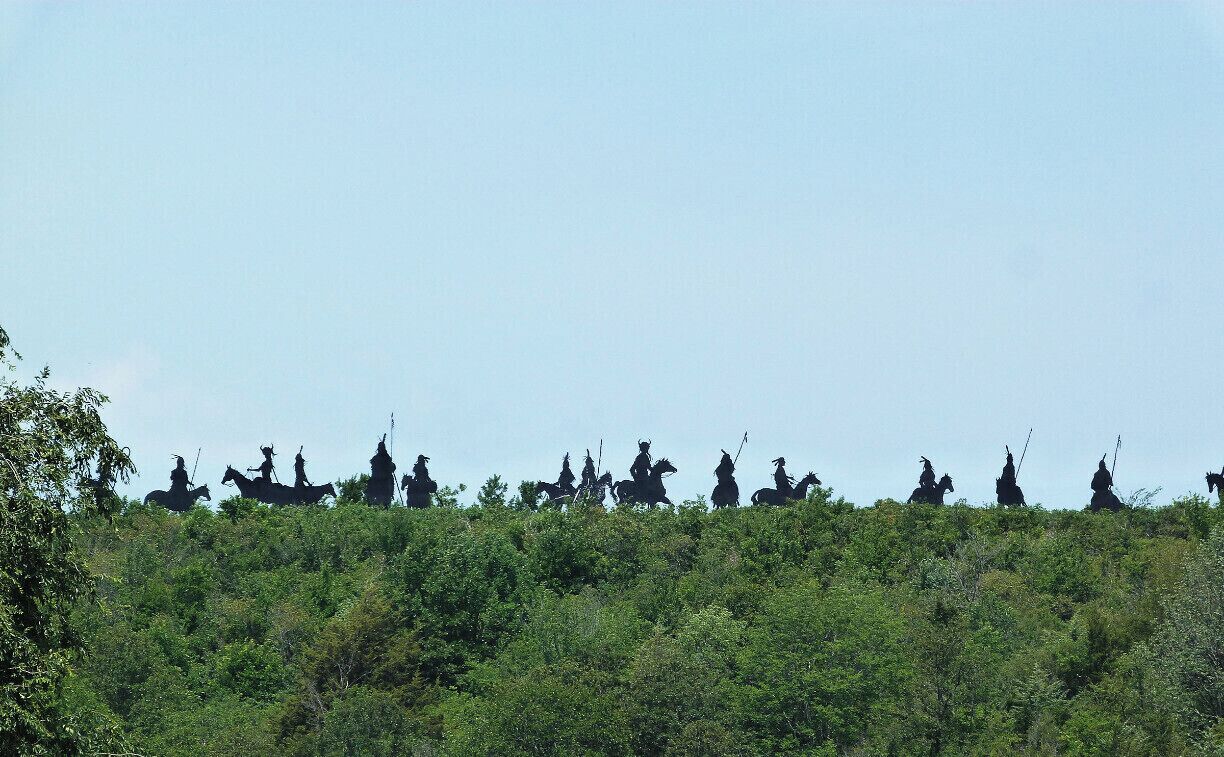Life size metal native Americans on horses by Hominy artist Che Tullis.