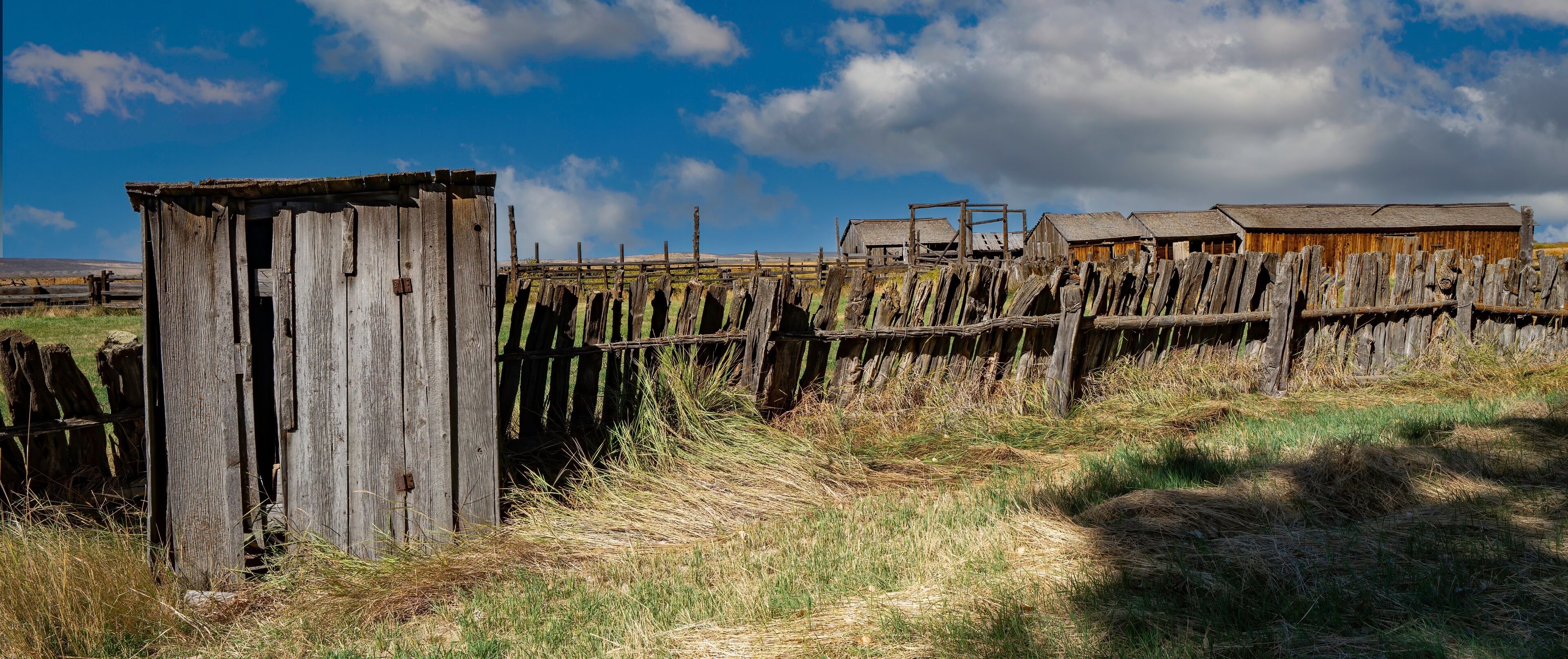 a Unique vintage fence with abandoned farm buildings near Frenchglen Oregon
