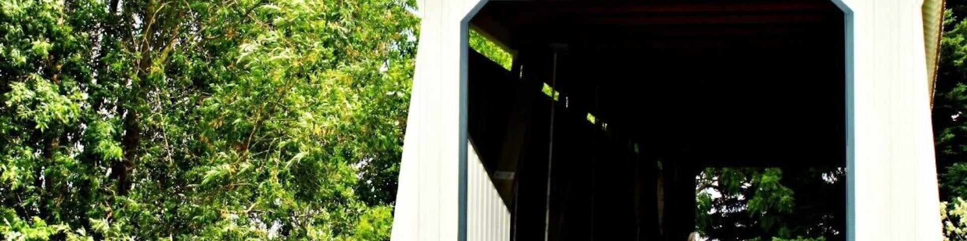 Located NNW about 2 miles from Silverton, Oregon - back roads towards Mt. Angel. Built in 1916 and is a covered bridge you can drive over