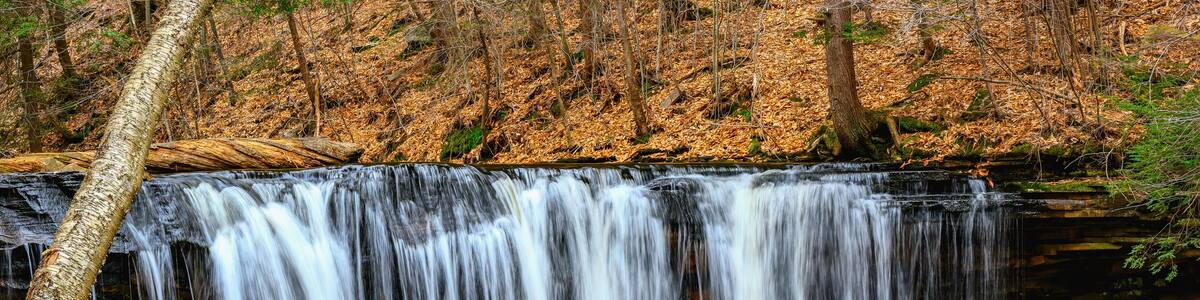 Spring at Ricketts Glen State Park in Benton PA. Known for its 21 waterfalls and old-growth forest and boulders. Hiking the loop on a cold Spring Day.