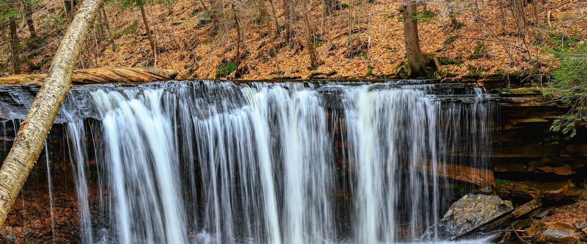 Spring at Ricketts Glen State Park in Benton PA. Known for its 21 waterfalls and old-growth forest and boulders. Hiking the loop on a cold Spring Day.