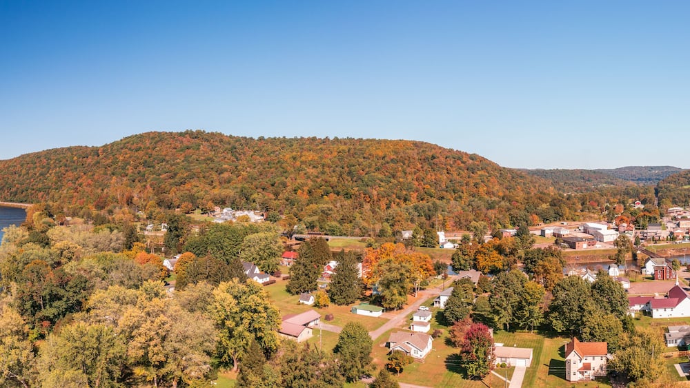 Aerial panorama of the small town of Confluence in Somerset County in Pennsylvania with fall colors on the leaves and trees