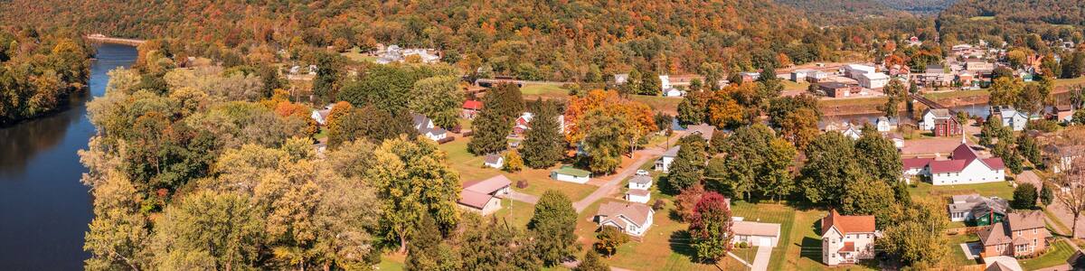 Aerial panorama of the small town of Confluence in Somerset County in Pennsylvania with fall colors on the leaves and trees