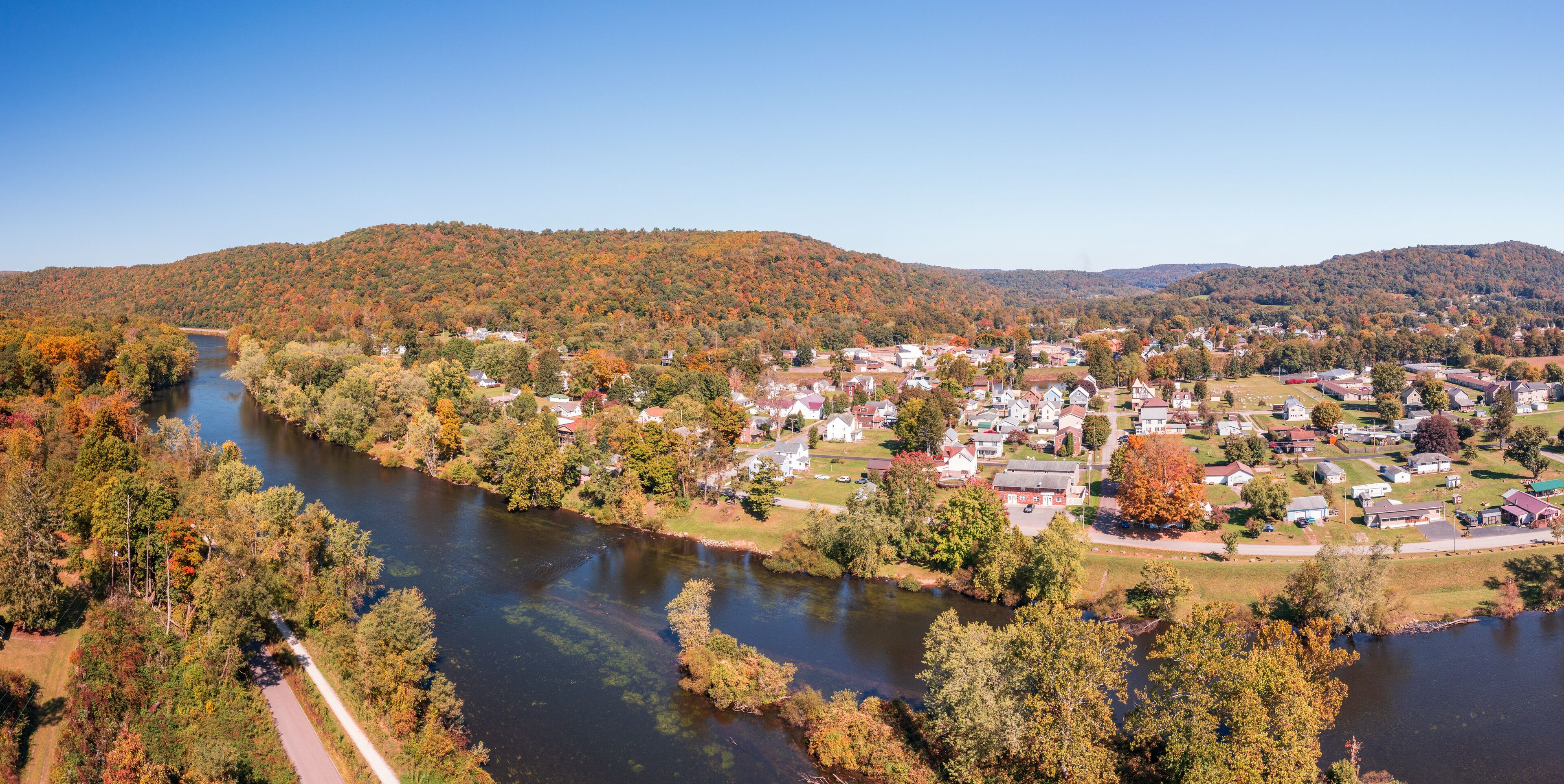 Aerial panorama of the small town of Confluence in Somerset County in Pennsylvania with fall colors on the leaves and trees