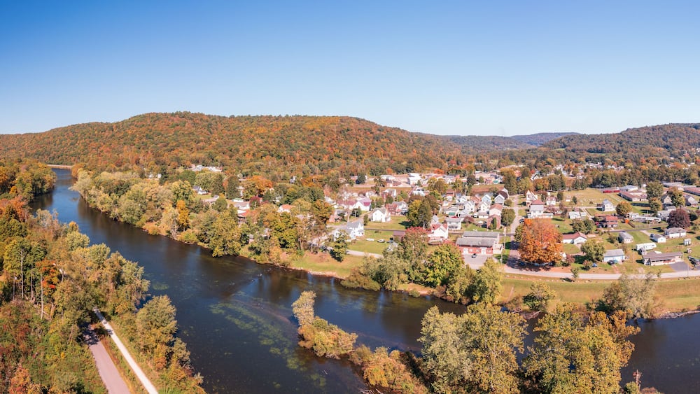 Aerial panorama of the small town of Confluence in Somerset County in Pennsylvania with fall colors on the leaves and trees