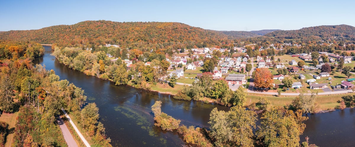 Aerial panorama of the small town of Confluence in Somerset County in Pennsylvania with fall colors on the leaves and trees