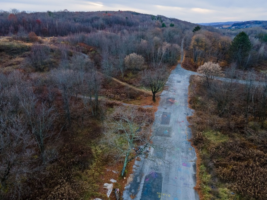 Aerial landscape of graffiti road and forest during Fall around abandoned coal town Centralia Pennsylvania