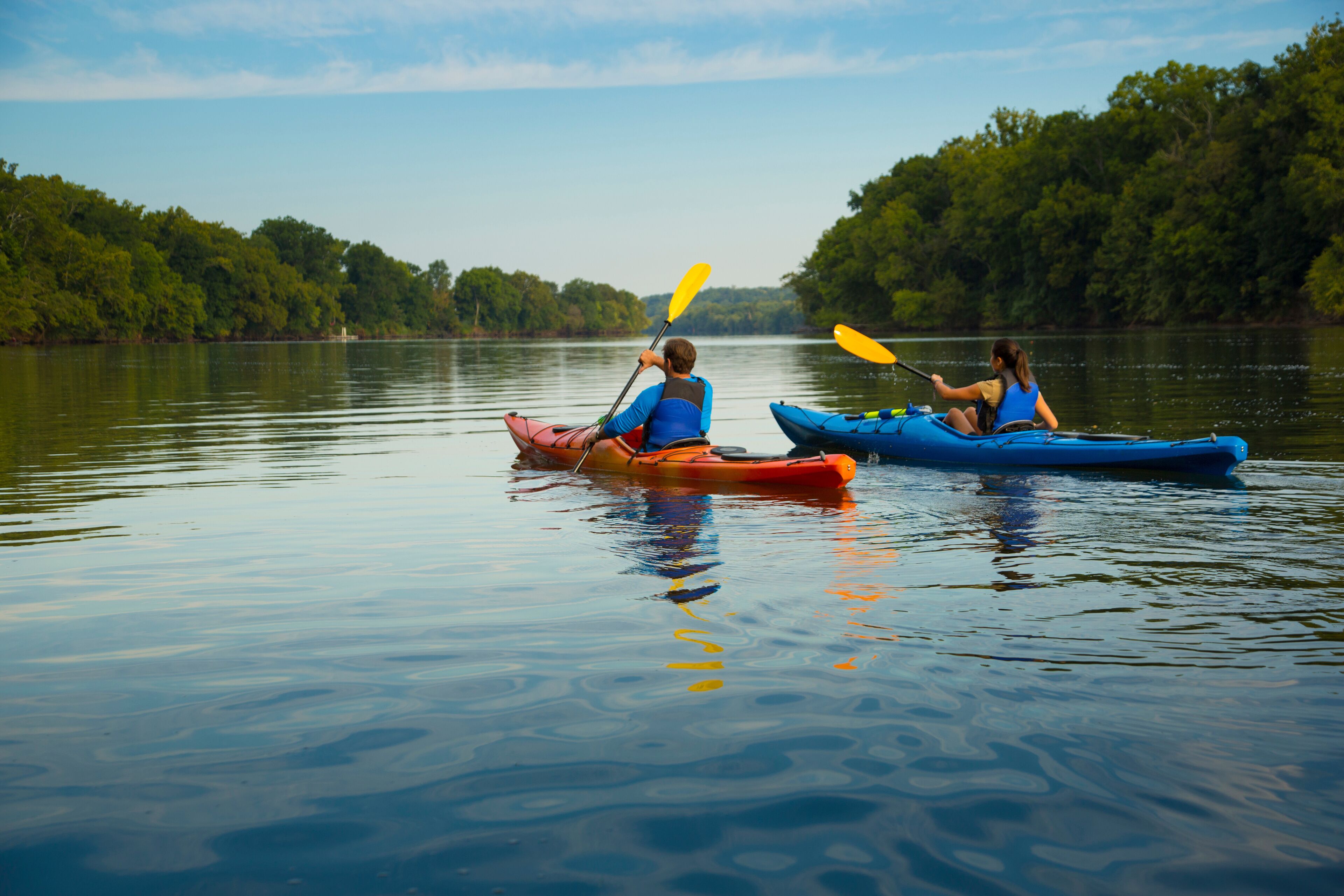 Couple kayaking in river
