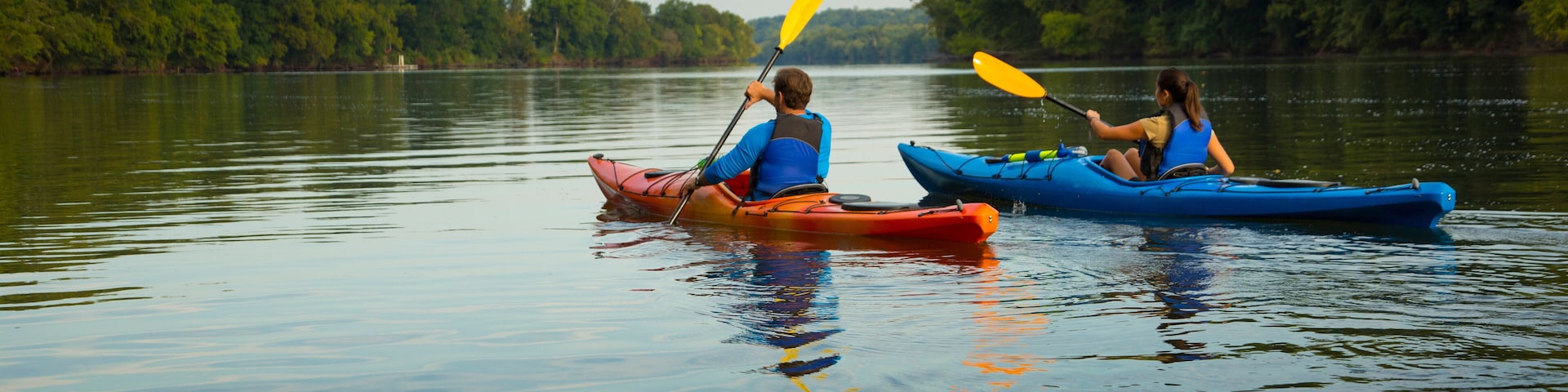 Couple kayaking in river