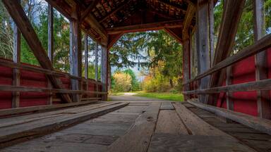 Inside a rustic, old covered bridge in Eastern Pennsylvania in autumn