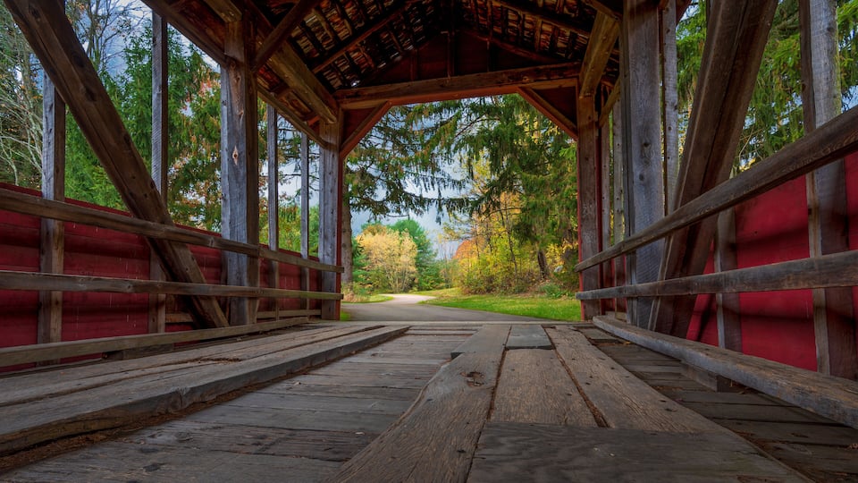 Inside a rustic, old covered bridge in Eastern Pennsylvania in autumn