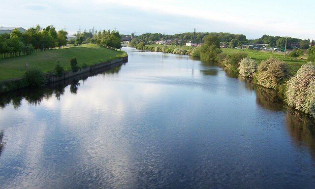 North from Ferrybridge Taken from the original bridge (John Carrs) at Ferrybridge looking Northward upstream on the River Aire. On the right horizon is the village of Brotherton. Centre horizon is a rail bridge over the river. Off shot to the left is Ferrybridge Power Station.