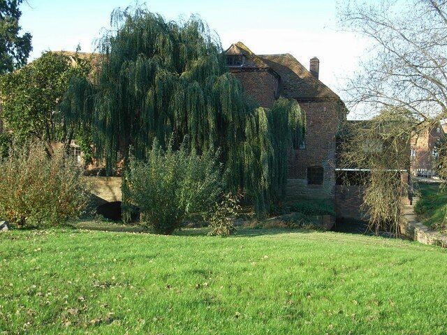 Two watermills at Fladbury One in the foreground and a partial view of the other, on the very right, across the weir.