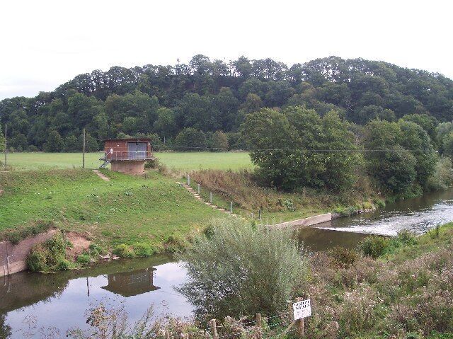 River Flow Measurement Station, Knightsford Bridge. Something comes out of the garage on a pedestal and is suspended over the River Teme on cables. Presumably this is lowered into the river to measure the flow.