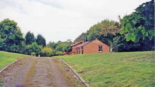 Knightwick: site/remains of station, 1999. View eastwards, towards Worcester: ex-GWR Worcester - Bromyard - Leominster line. The station closed 7/9/64 along with the remnant of the branch to Bromyard; Bromyard - Leominster has been abandoned since 15/9/52.