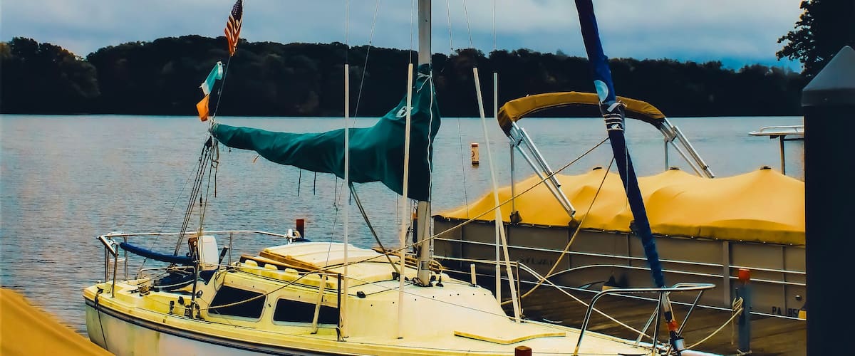 A docked sailboat in a marina on Pymatuning Lake in a park in Jamestown, Pennsylvania