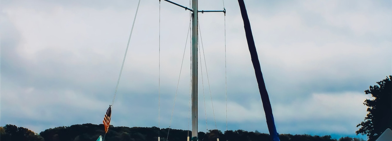 A docked sailboat in a marina on Pymatuning Lake in a park in Jamestown, Pennsylvania