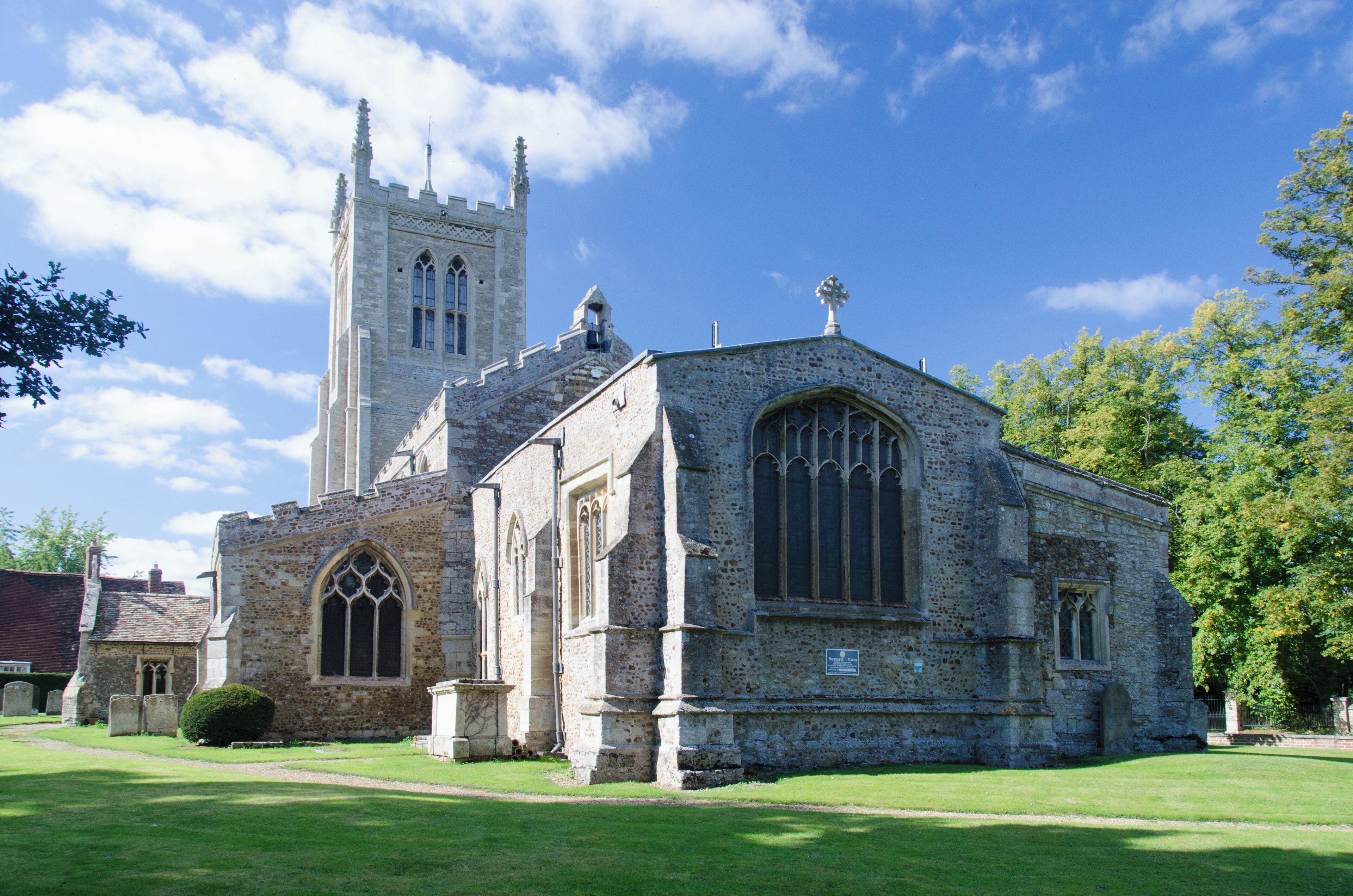 A historic church with a tall tower and arched windows.