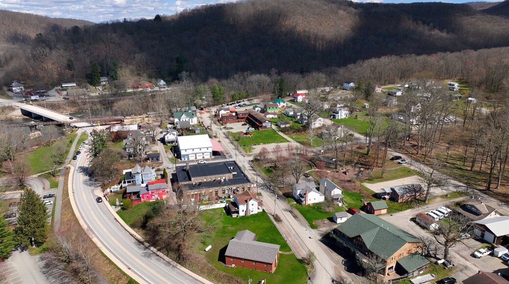 Small mountain town Ohiopyle, Pennsylvania with state park by Youghiogheny River used for whitewater rafting and kayaking adventures and near hiking trails and waterfalls