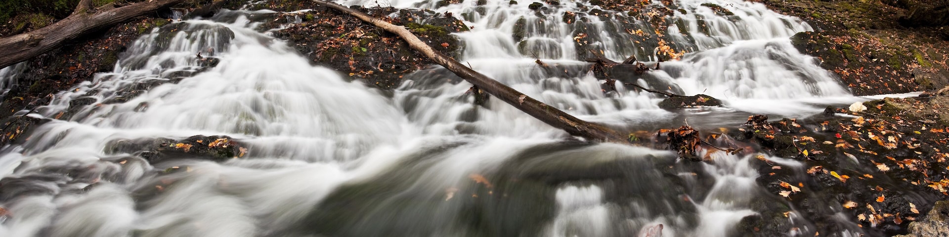 Buttermilk Falls in autumn, covered in fallen leaves