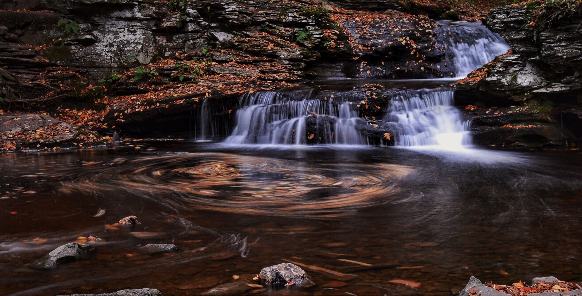 Fall hiking with some friends. I always wanted to capture the swirling effects of the fallen leaves in the water. #nature #fall🍁#autumn #waterfalls #colorful #hiking #waterlust #NikonD7100 #Manfratto tripod. 