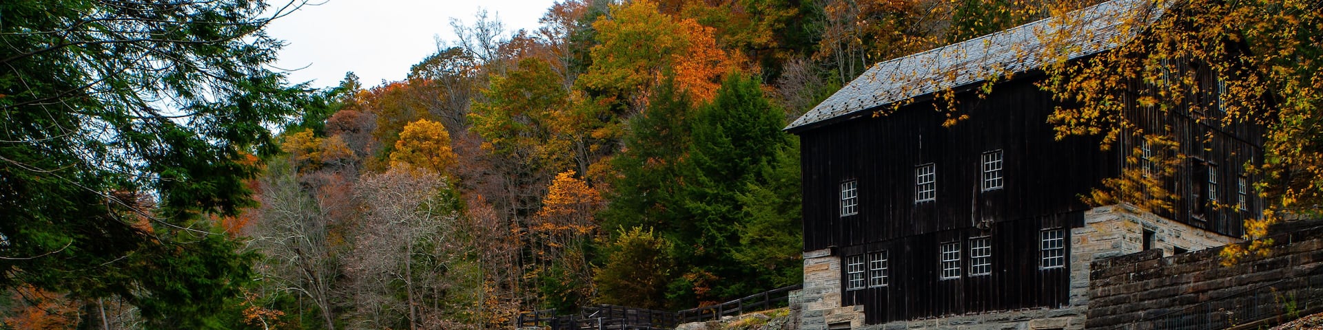 Rustic Mill Adjacent to Rushing Stream in Peak Autumn / Fall Season - McConnells Mill State Park - Pennsylvania