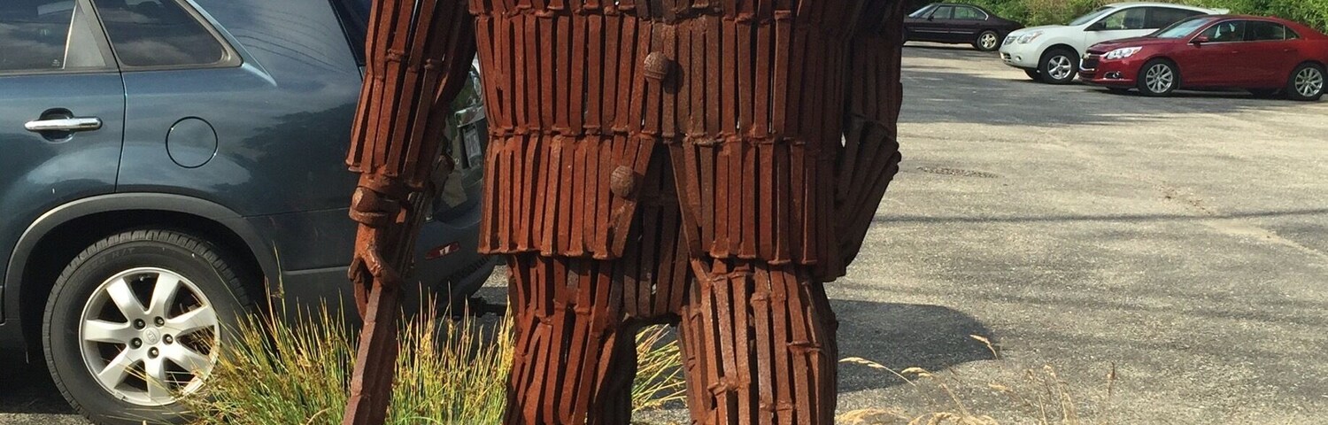 This iron man is made totally out of railroad spikes. This marks the GAP bike trail in West Newton, PA