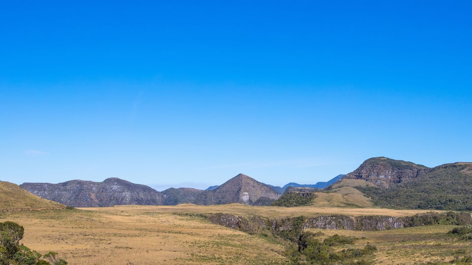 A mountainous landscape with a clear sky.